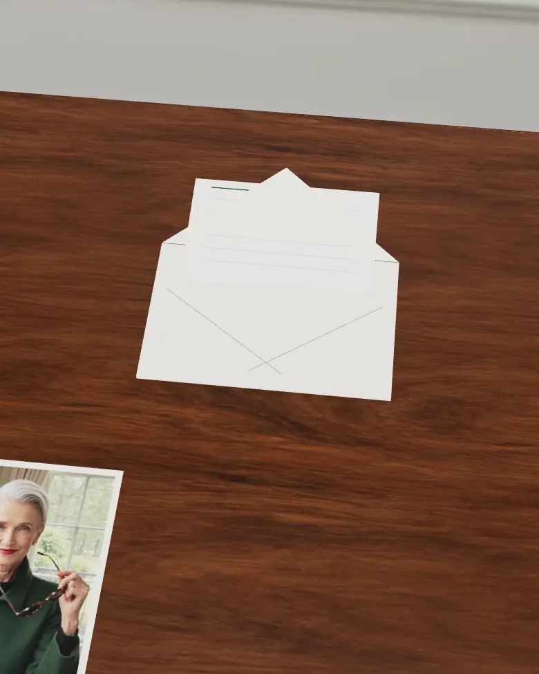 The envelope with its flap open and a ruled letter drawn halfway out.