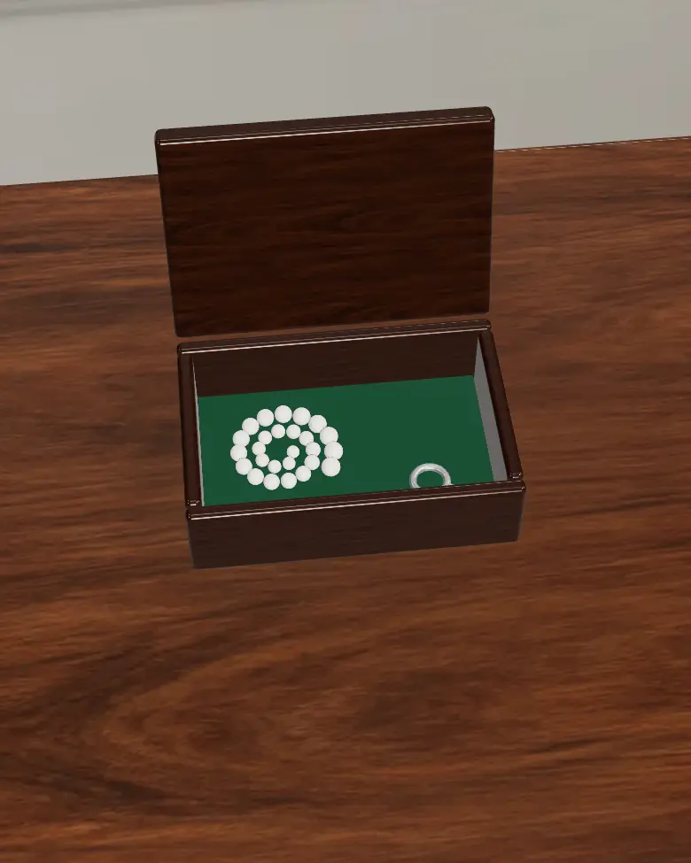 The walnut box with its lid lifted: a spiral of pearls and a small steel key.