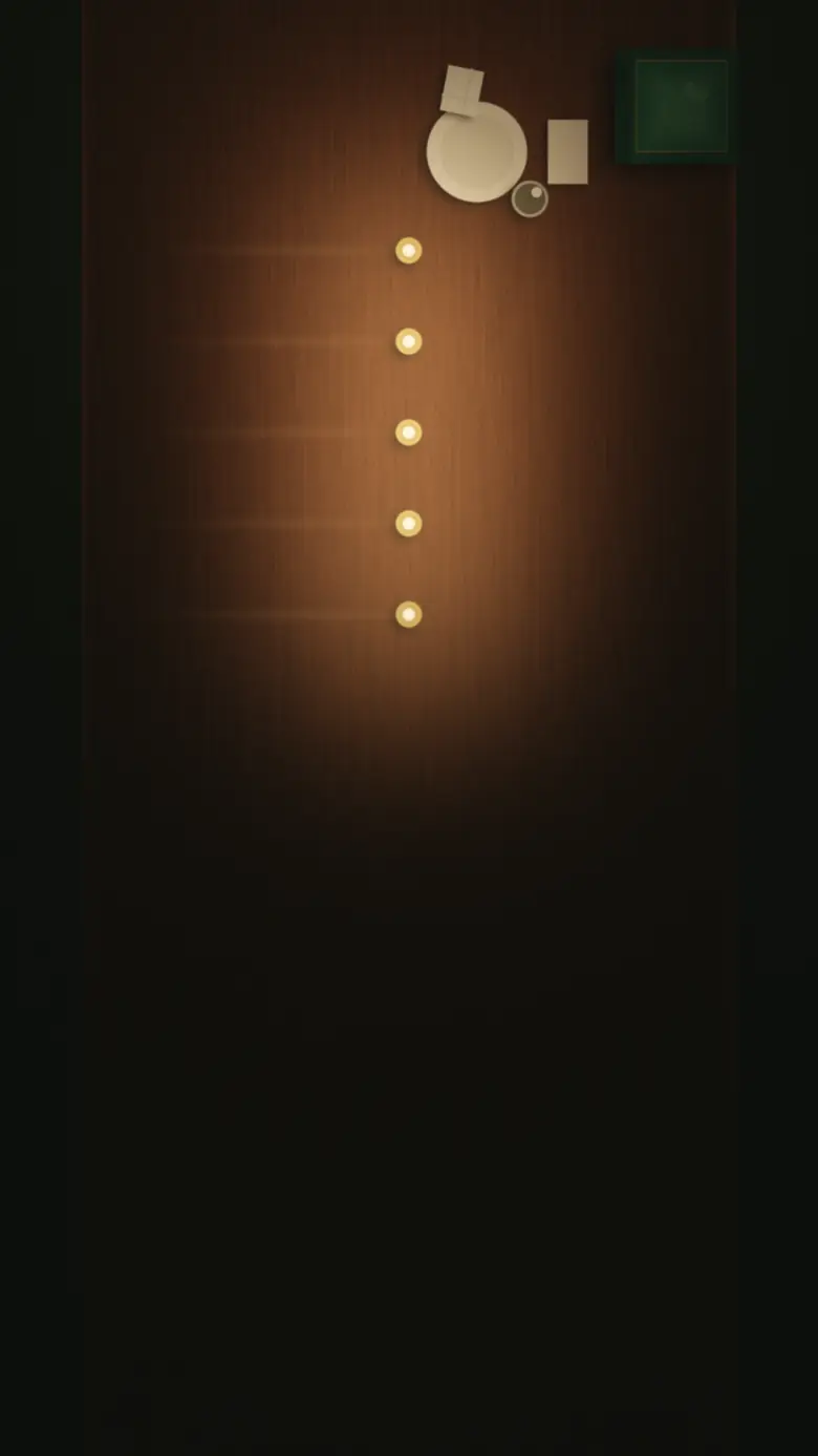 A long club table laid for one at night, five candles lit down its centre.
